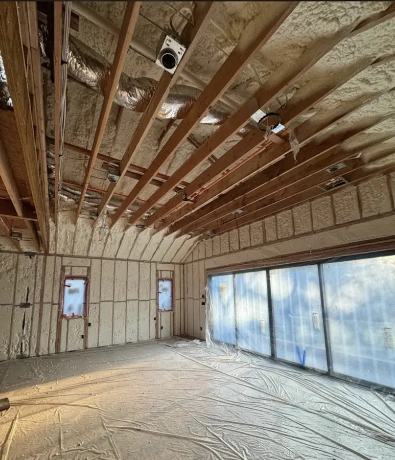 Interior walls and ceiling insulated with spray foam during new construction in Torrington